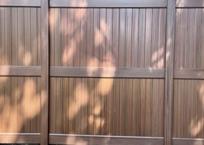 8-foot residential wood grain vinyl fencing with mid-rail